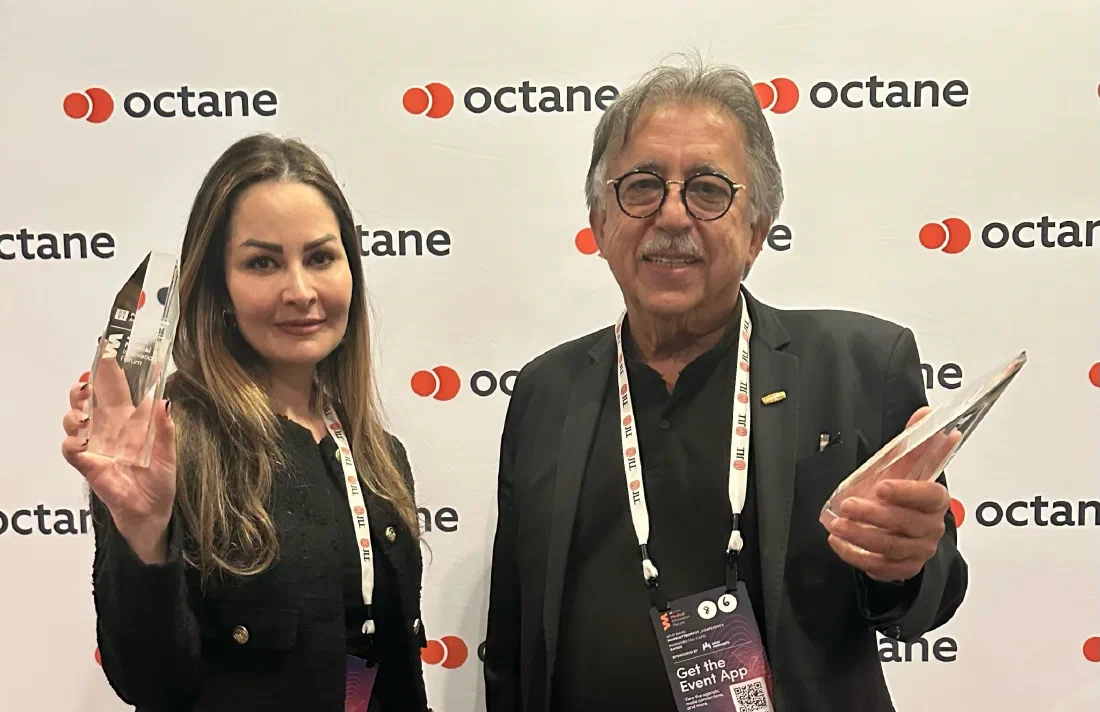 Mehdi Hatamian and a colleague each holding a glass award at Octane's Medical Innovation Forum